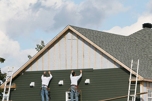 Professional Siding technician working in Newark, TX